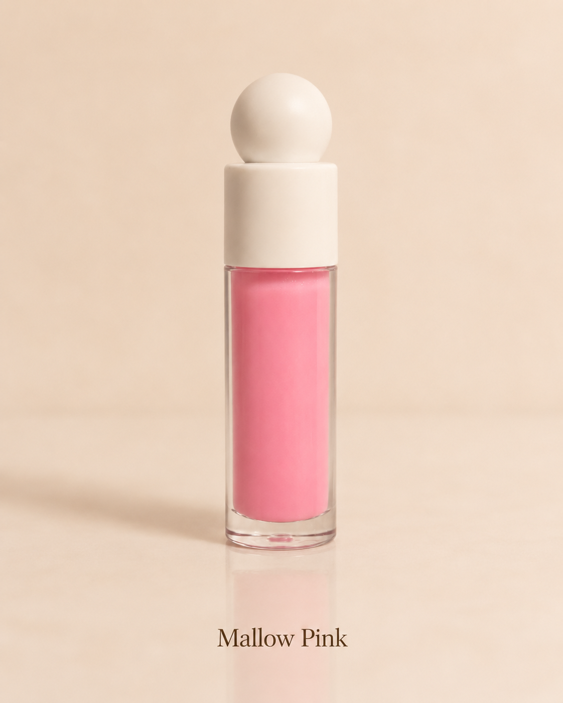 Pink lip gloss with a white cap on a beige background
