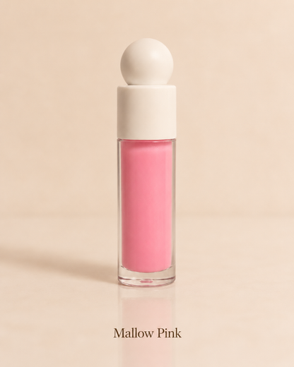 Mallow Pink lip gloss with an ivory spherical cap on a warm beige background