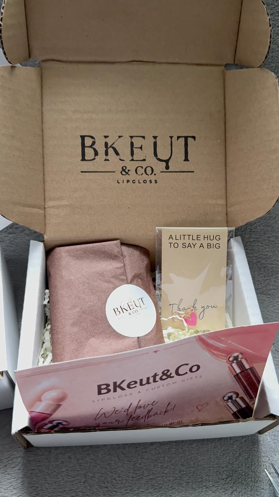 BKeut and Co gift box presentation with wrapped lip gloss and thank-you card