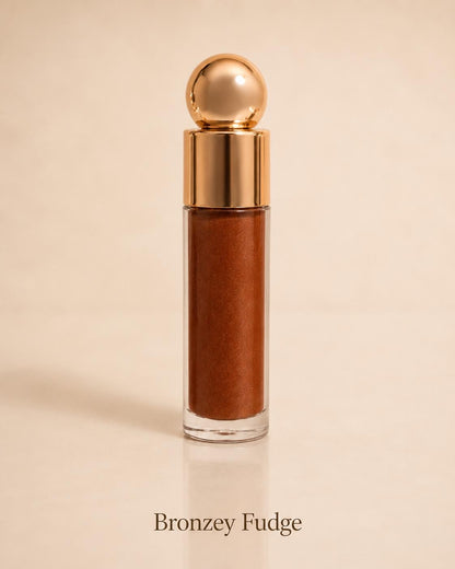 Bronzey Fudge shimmering bronze lip gloss on a warm beige background