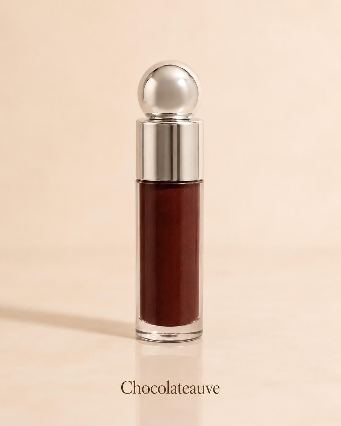 Chocolateauve deep brown lip gloss on a warm beige background